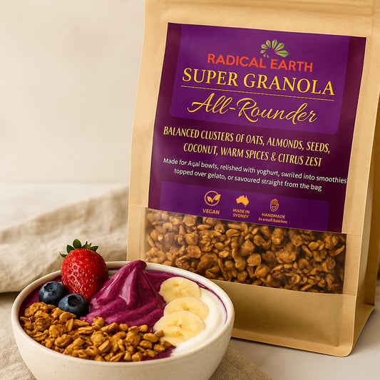 Bag of Radical Earth Super Granola with a bowl of granola and fruit
